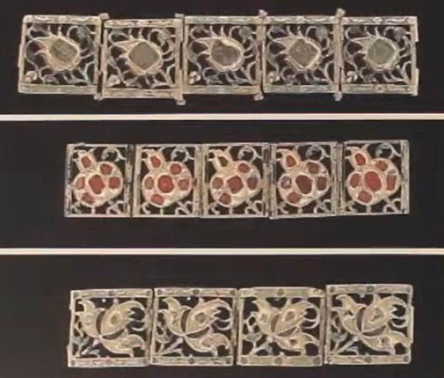 Examples of "forged lace" plaques used to decorate clothing and hats.